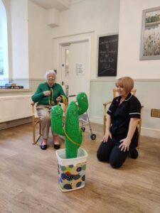 A resident throws hoops in a fun activity