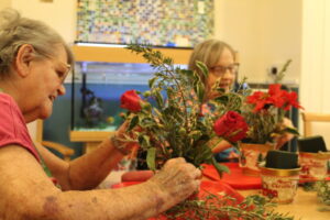 Residents arranging flowers