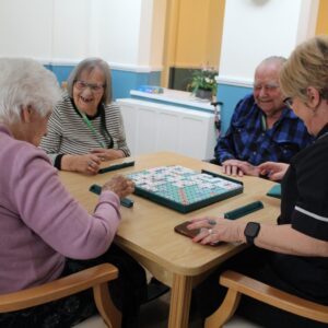 Residents enjoying activities and company at Watermoor House
